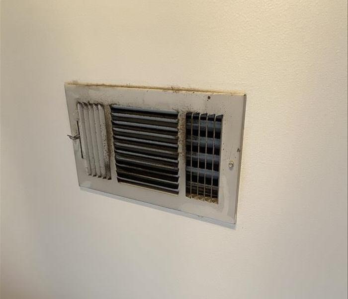 Dirty AC vent that is sysmbolic of the need to have the HVAC system inspected and cleaned.